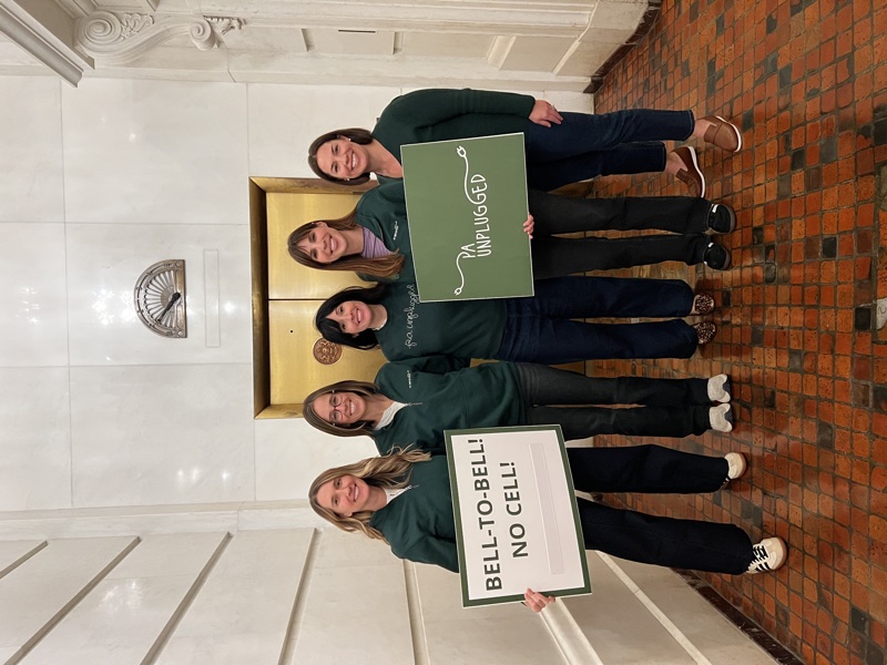 The five PA Unplugged team members with Bell-to-Bell and PA Unplugged signs